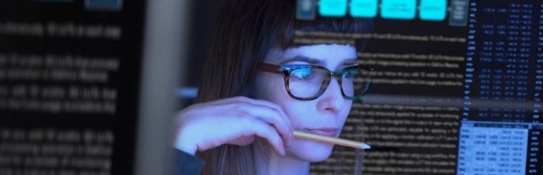 Woman looking at screens